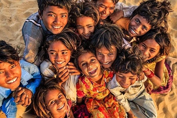 Joyful group of children smiling in a rural community